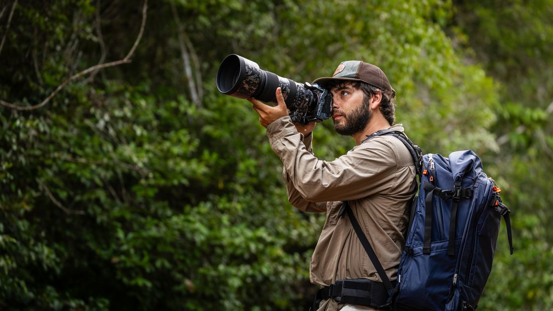 Greg shooting with a telephoto lens in Kenya