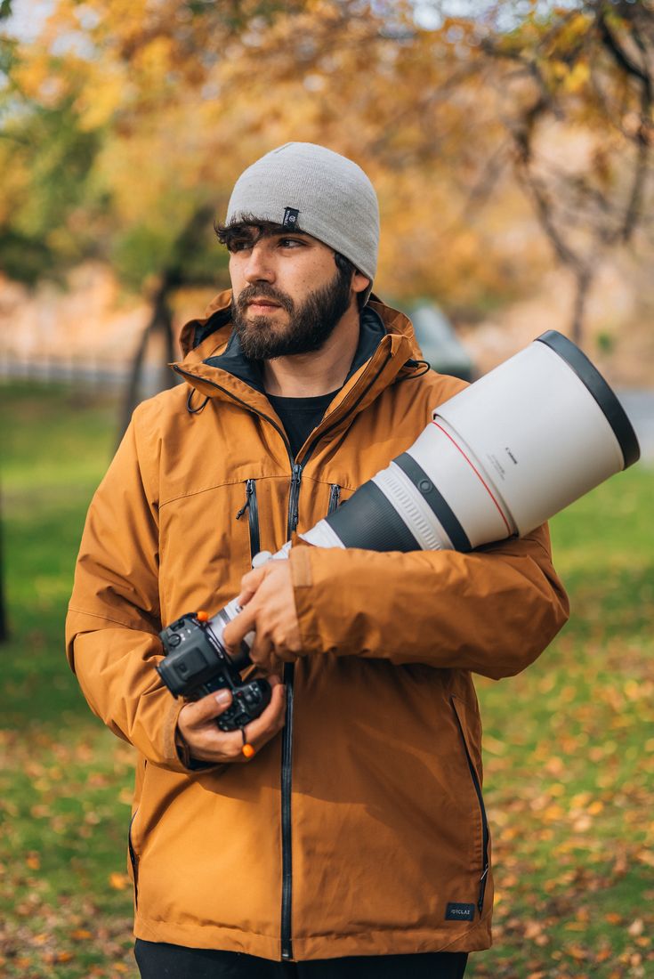 Greg with a telephoto lens in autumn